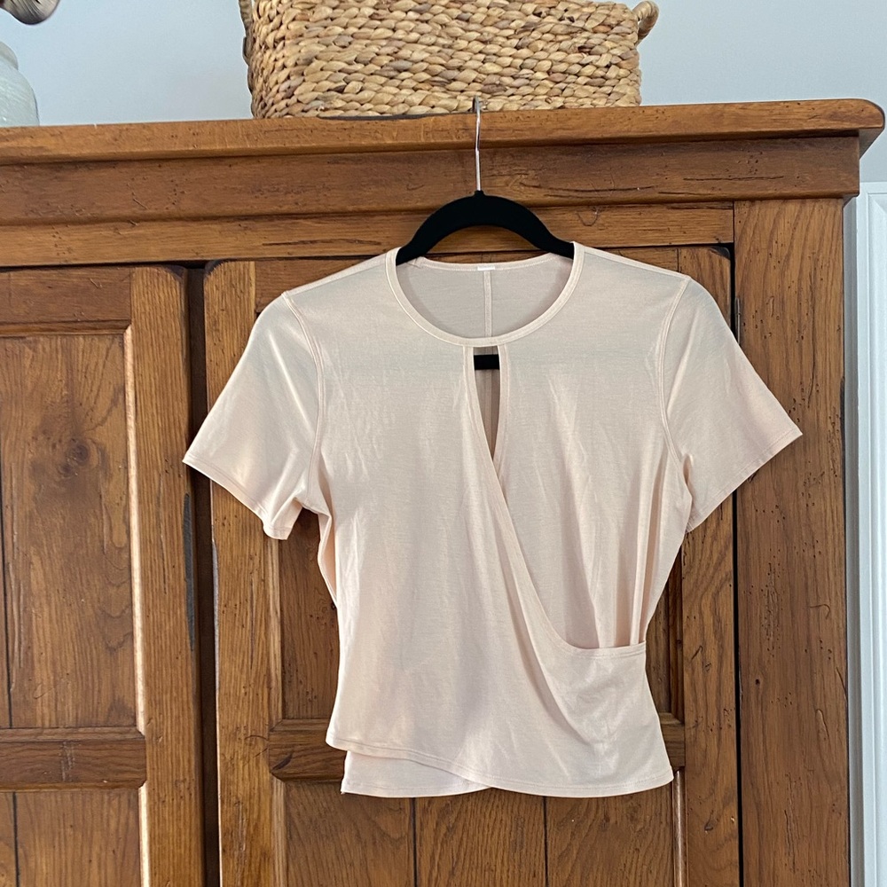 Lululemon light pink/coral crisscross crop short sleeve top! Worn ONCE.